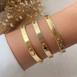 Pulseira de plaquinha (cada) - P200 - Lojas das Revendedoras