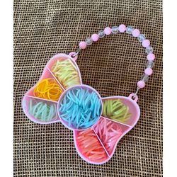 ELÁSTICOS PARA CABELO - EM UMA MINI BOLSA EM FORMA... - MONOWI 