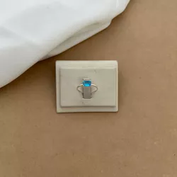 SOLITÁRIO COM ZIRCÔNIA RETANGULAR AZUL CLARO - 255... - Pratas Pomposa