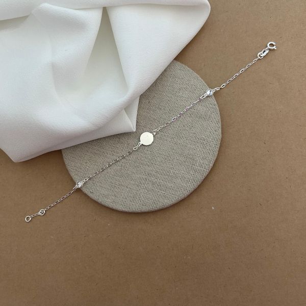 PULSEIRA 1 PLAQUINHA REDONDA LISA 2 ZIRCÔNIA CRISTAL ELOS ALONGADOS