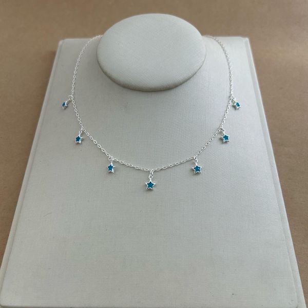 CHOKER COM 7 ESTRELAS DE ZIRCÔNIA AZUL PENDURADAS CARTIER 
