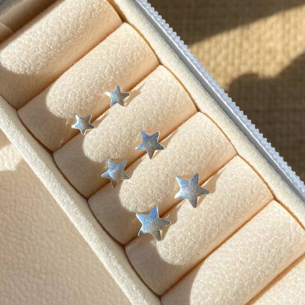 Trio de estrelas na prata 