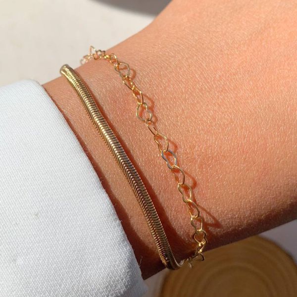 Pulseira dupla de malha com coração vazado 