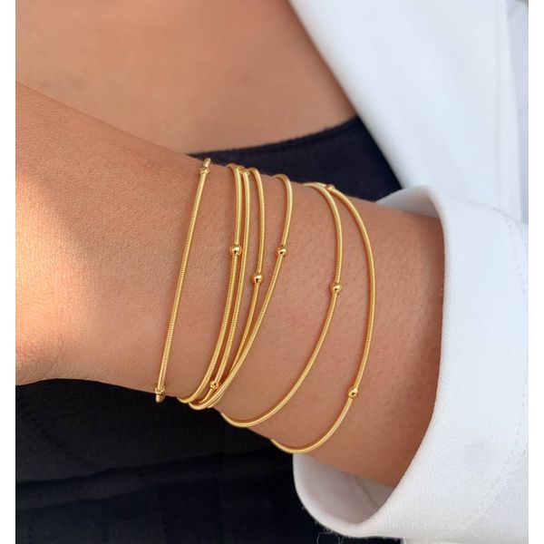 Pulseira corda de violão com bolinhas