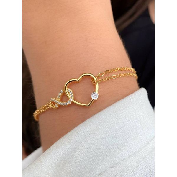 Pulseira infinito cravejado com coração liso e vazado 