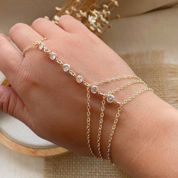 Pulseira de mão com ponto de luz 