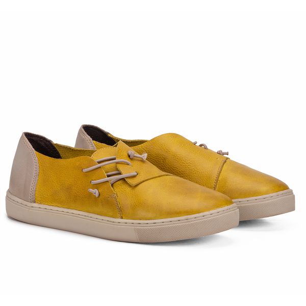 Tenis Confortavel Em Couro Amarelo Com Elastico Off White E Sola De Borracha Branca