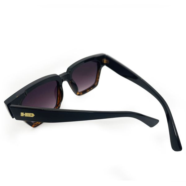 Óculos de sol HD Swell Animal print com armação e hastes pretas e lentes com proteção UV