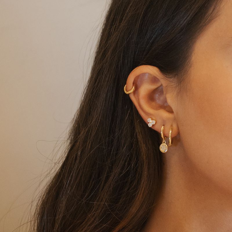 Brinco Calma- banho ouro 18k