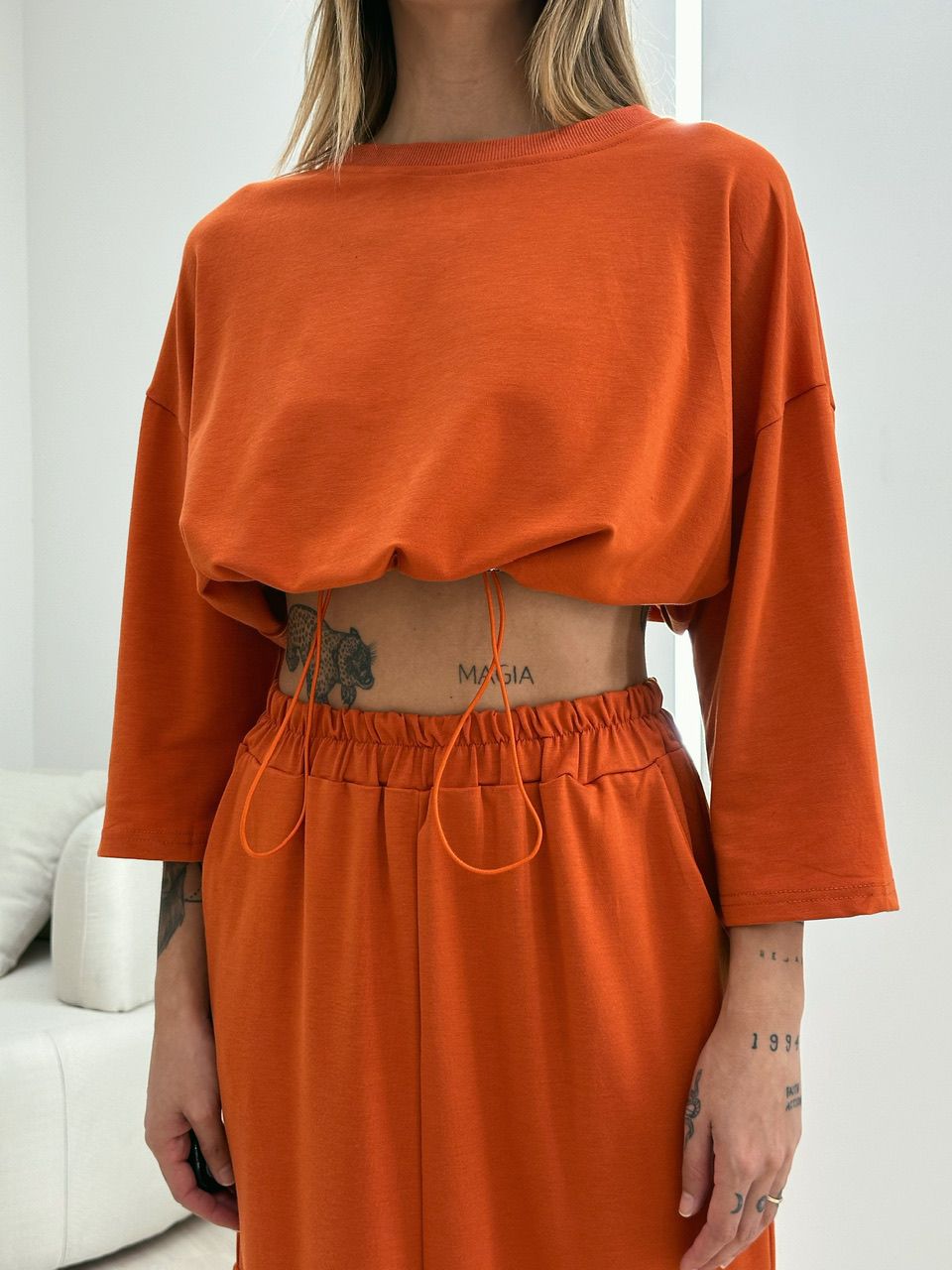 CONJUNTO MOLETINHO SAIA LARANJA
